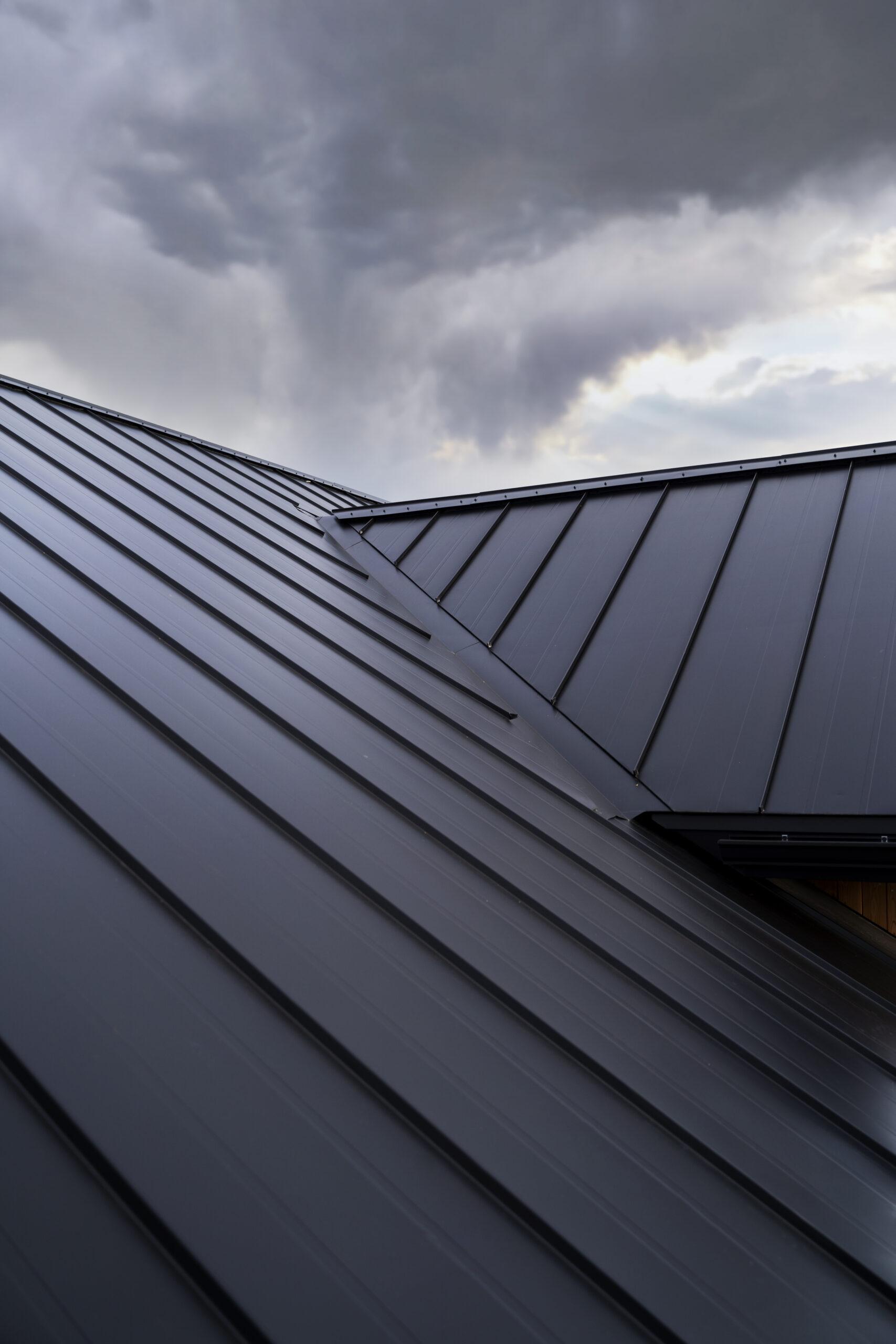 low angle modern house roof clouds (1)